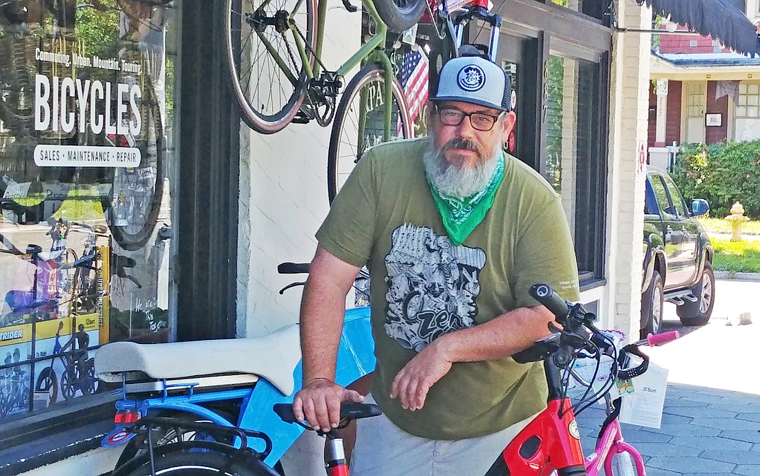 ZenCog Bicycle Co. owner Garfield Cooper set up a showroom outside his store at 883 Stockton St. Customers are not allowed inside his store because of the COVID-19 pandemic