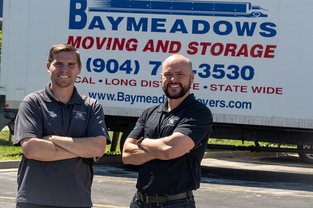 Brothers Chris and Michael McCreary are transitioning to take over Baymeadows Movers, started by their parents in 1996. (Photo by Jason Pratt)