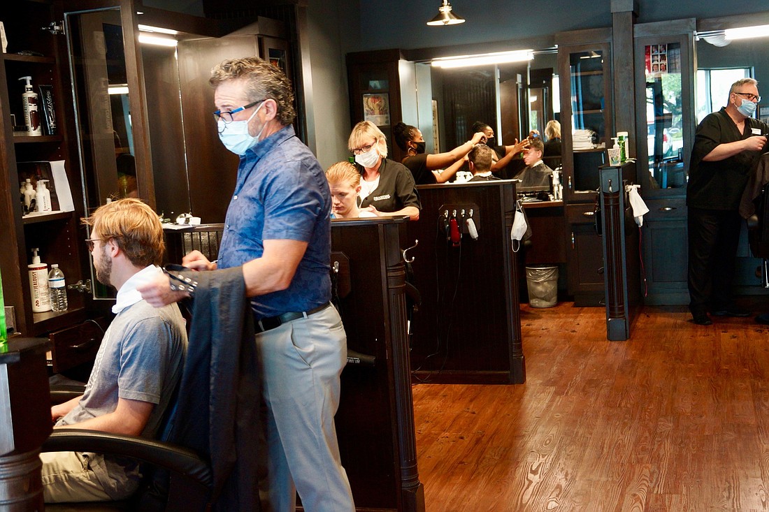 Customers at Roosters Menâ€™s Grooming Center at 2000 Hendricks Ave. in San Marco got their hair cut May 20.