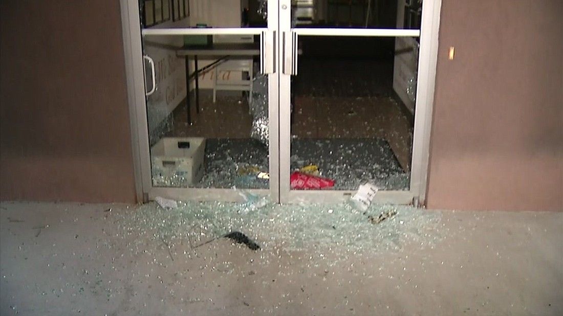 Broken glass doors at the Duval County Supervisor of Elections building.Â (News4Jax.com)