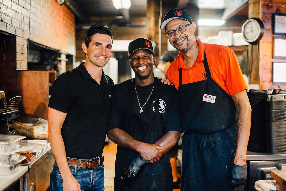 From left, Bonoâ€™s Pit Bar-B-Q President Josh Martino with Bo Cherry, pit boss since 1988, and Wendell Taylor, general manager since 1991.