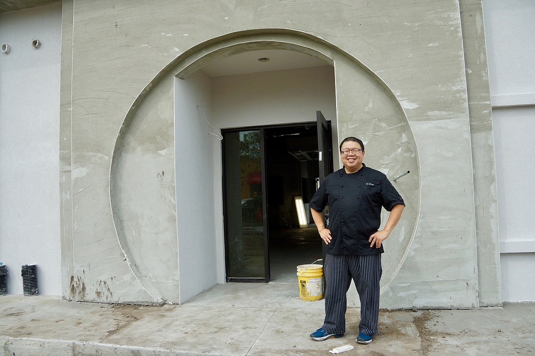 Blue Bamboo owner Dennis Chan in the doorway of the building he is renovating into his new restaurant at 10110 San Jose Blvd. in Mandarin.