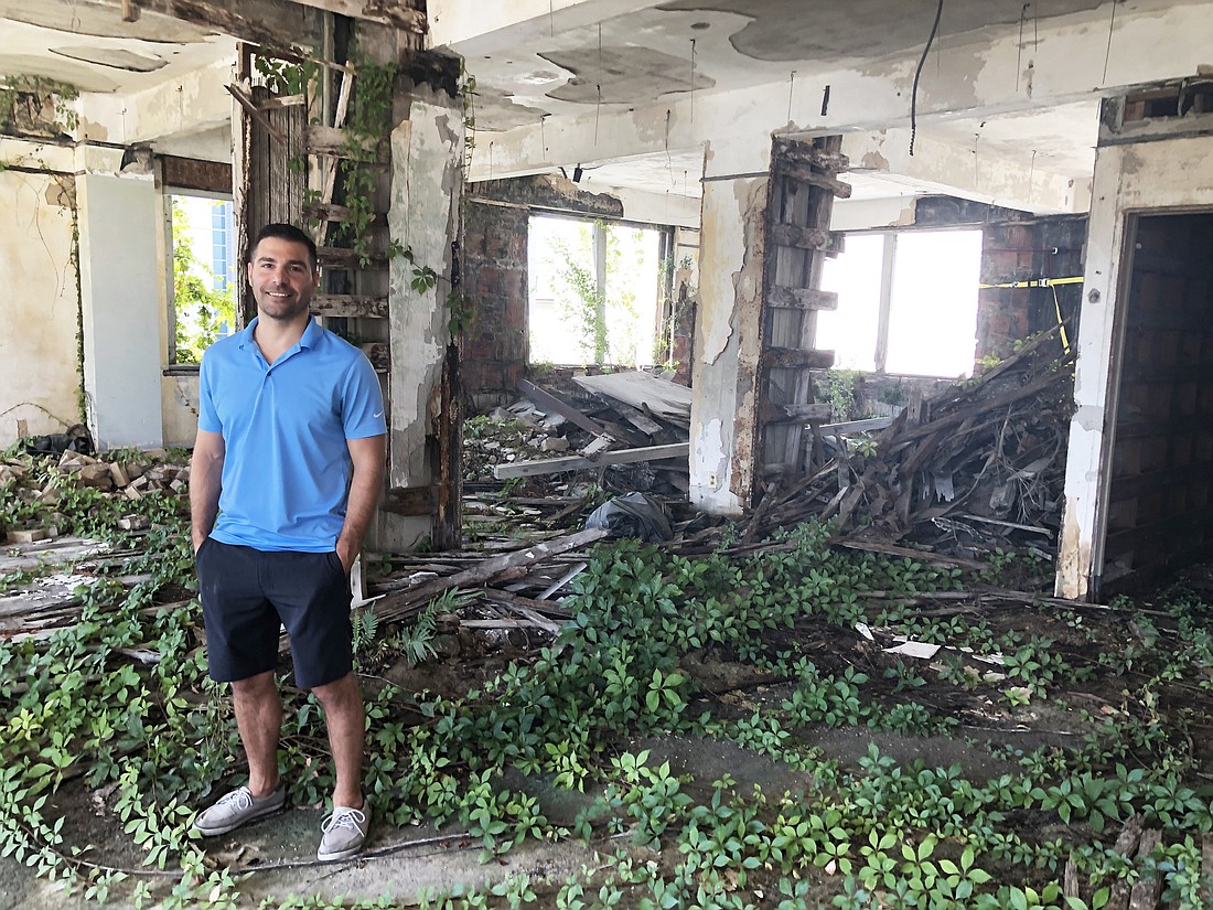JWB Real Estate Capital President Alex Sifakis inside the 218 W. Church St. building his company purchased in August. JWB plans to redevelop the property as apartments with commercial space on the ground floor.