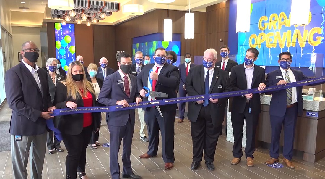 VyStar President and CEO Brian Wolfburg and other dignitaries cut the ribbon at the grand opening ceremony.