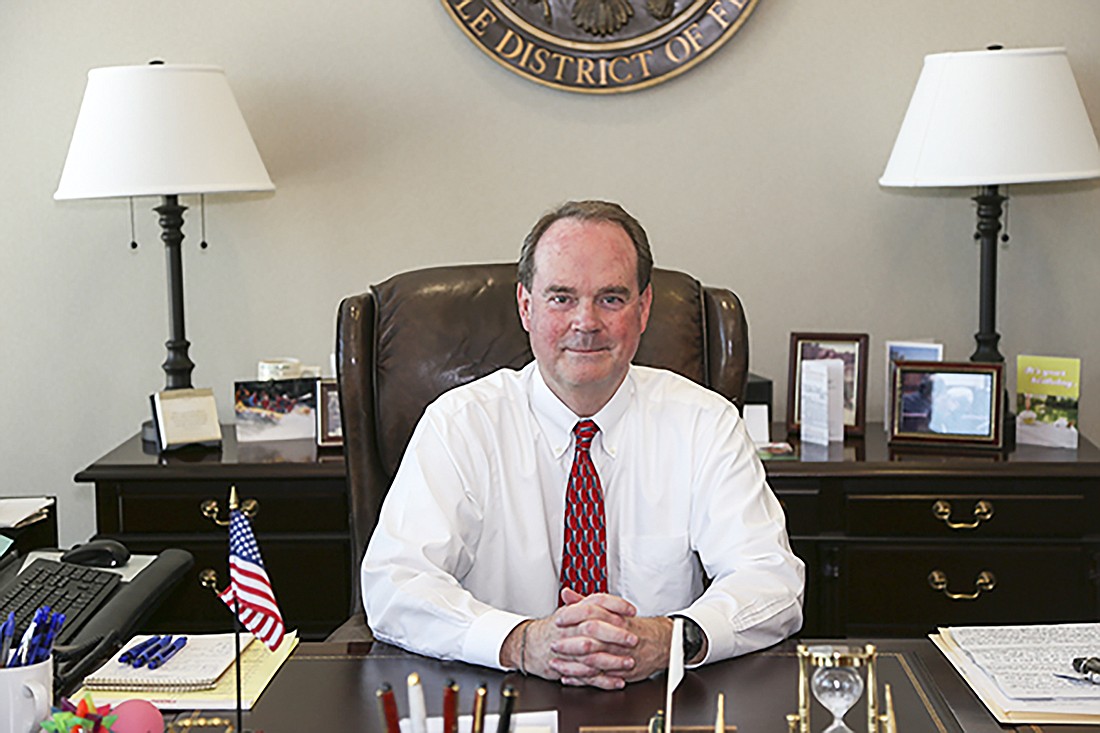 U.S. District Judge Timothy Corrigan.