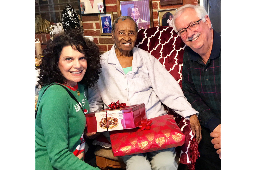 Duval County judges Eleni Derke and Roberto Arias delivered gifts to a senior as part of the JBA&#39;s 2018 Holiday Project.