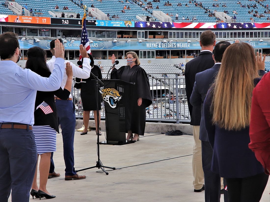 U.S. District Judge Marcia Morales Howard administered the oath of citizenship to 51 people Nov. 29 at TIAA Bank Field at halftime during the Jacksonville Jaguars vs. Cleveland Browns game.