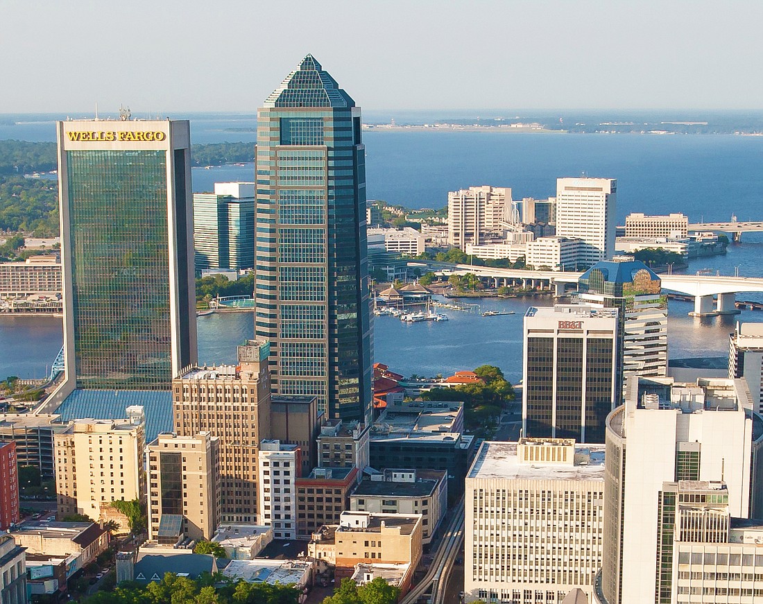 Group RMC acquired the Bank of America Tower, the Iberiabank building next door and a parking garage.