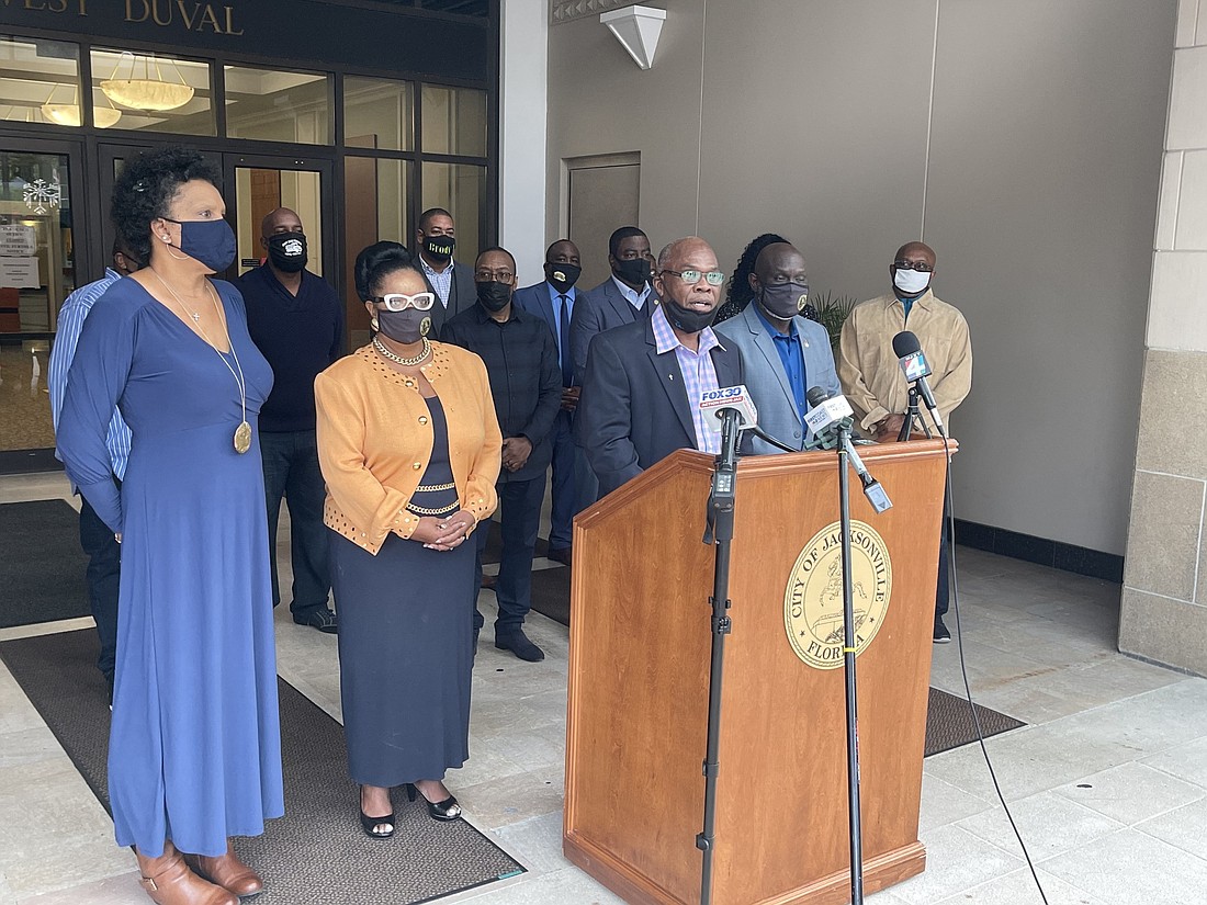 Jacksonville City Council member Reggie Gaffney speaks at a news conference Dec. 30. At left are Council members Brenda Priestly Jackson and Juâ€™Coby Pittman. At right is Council Vice President Sam Newby,