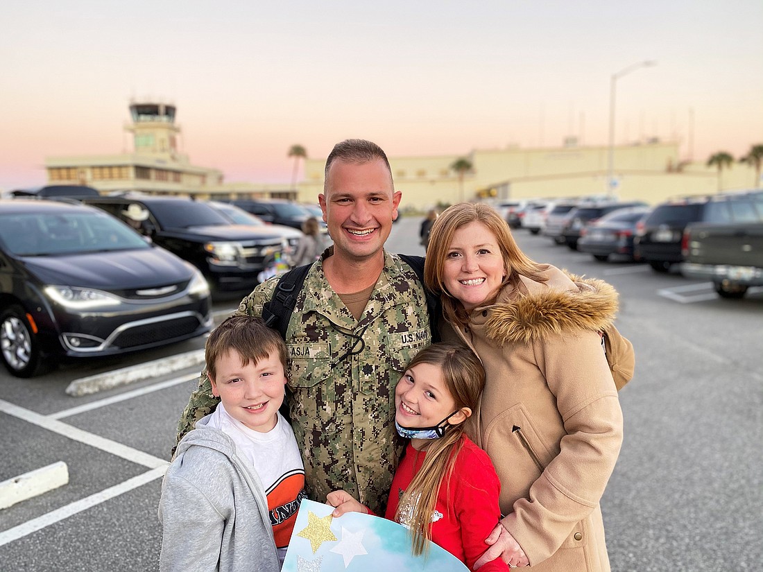 Rogers Towers partner and U.S. Navy Reserve Cmdr. Adam Brandon was reunited Dec. 8 with his wife, Kristi, and children John, 11, and Katherine, 9, after six months recalled to active duty at Naval Station Guantanamo Bay in Cuba.