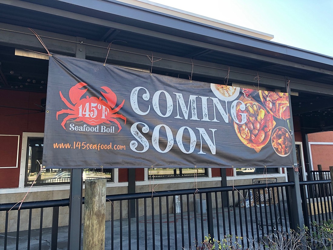 A banner sign at the former Applebeeâ€™s in the Town Center area announces its next tenant.