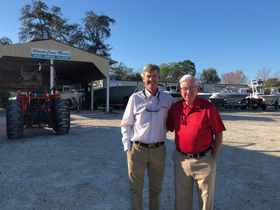 Cannon Marine Partners President Brett Cannon and Managing Partner Carl Cannon at their Atlantic Boulevard dealership that will be rebuilt.