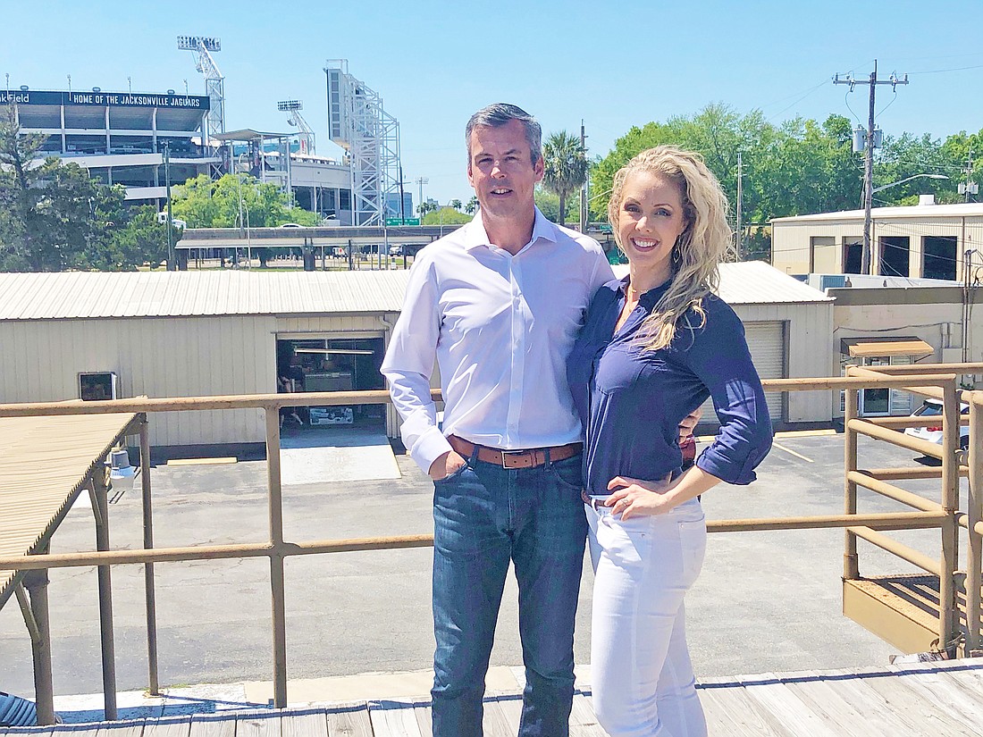 Jesse and Brittany Culbreth on the building deck at 1750 E. Duval St. They plan to renovate the structure as the headquarters for Emerald Câ€™s Development Inc., their general contracting firm.