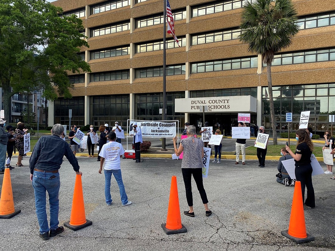 Demonstrators gather outside the Duval County Public Schools Building.  The issue has sparked public reaction, both for and against the name change. (News4Jax.com photo)