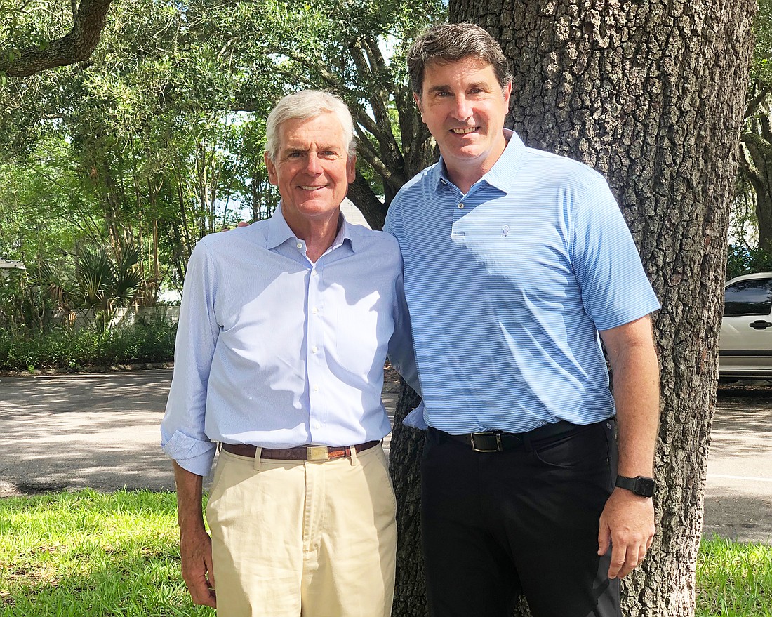 Retiring Jacksonville real estate executive John Carey and Marc Munago, who was promoted to fill the executive vice president role at VanTrust Real Estate.