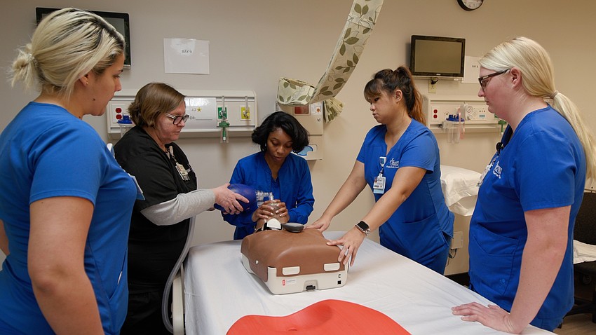 Nurses from local hospitals train with medical manikins at Jacksonville Universityâ€™s Healthcare Simulation Center.