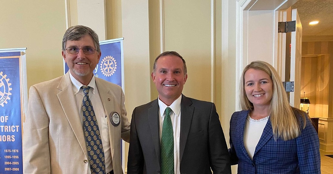 John McCorvey, left, and Jennifer Grippa of Miles Mediation & Arbitration announced the opening of their Jacksonville office at the Rotary Club of West Jacksonville and met with Mayor Lenny Curry, center.
