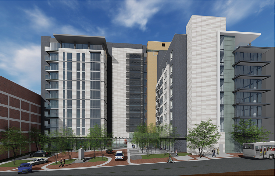 A rendering of the multifamily second phase of the Laura Street Trio redevelopment viewed from Adams Street. The building is on the left behind the driveway and circular pedestrian walkway. At right is a planned hotel.