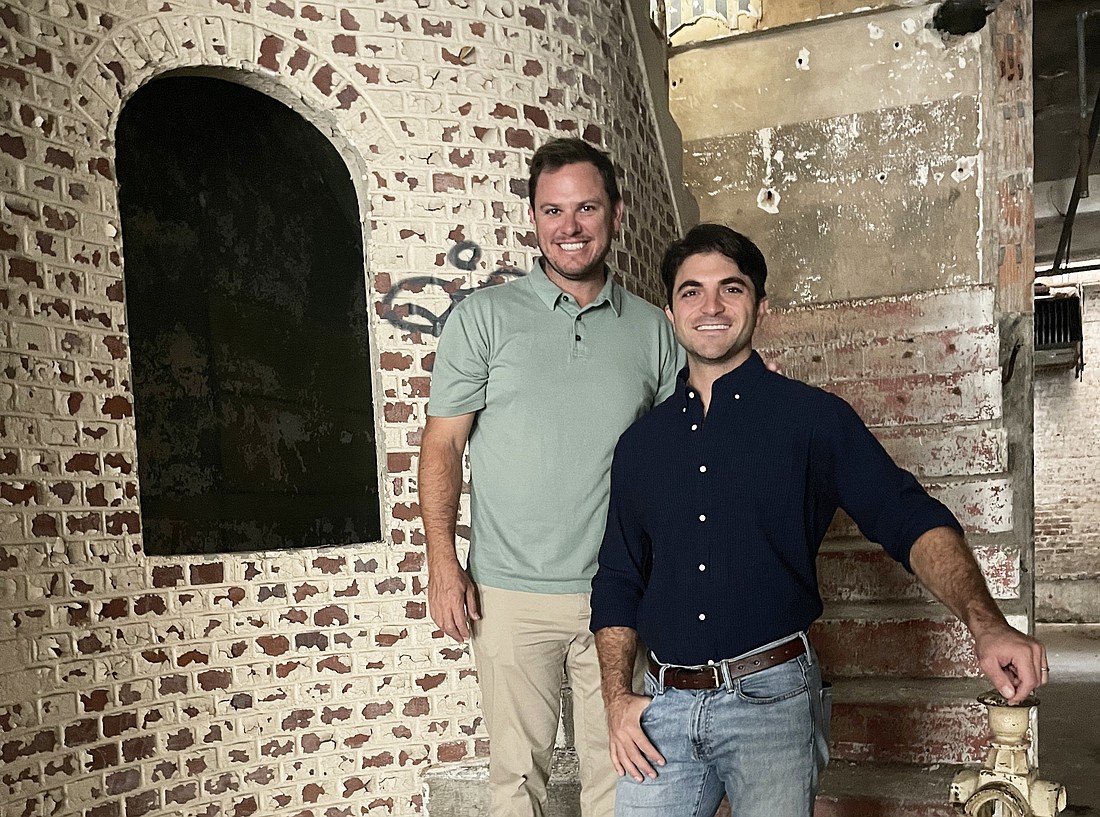 Development partners Andy Allen and Elias Hionides inside the historic Jones Bros. Furniture Co. building Downtown at 524 N. Hogan St.