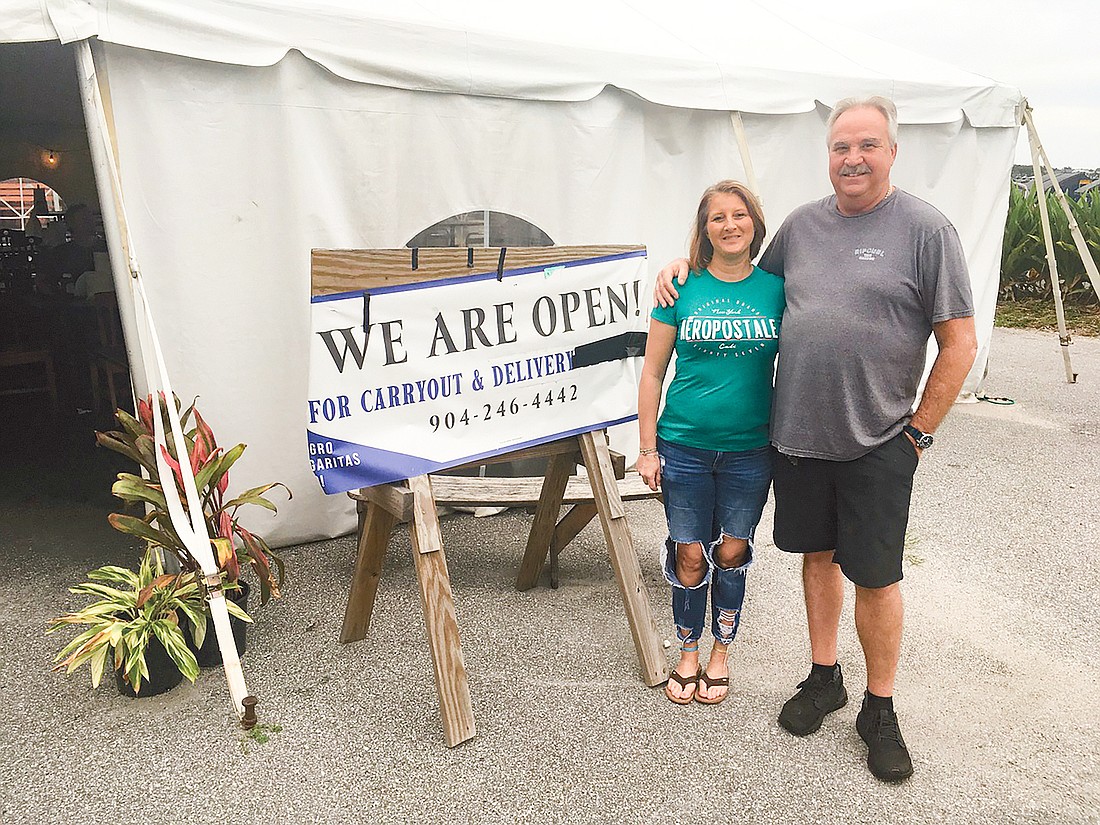 Singletonâ€™s Seafood Shack owners Tabitha and Dean Singleton are using a tent as a dining room and offering takeout service. They hope to complete remodeling by the end of November and reopen their dining spaces.