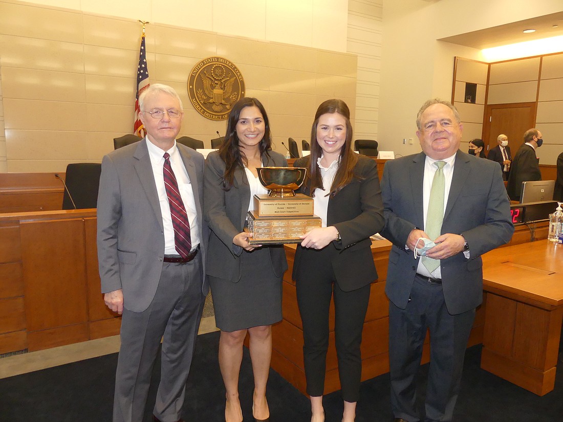 Smith, Gambrell & Russell Senior Partner Dana Bradford; Hulsey-Gambrell Moot Court competition winners and University of Georgia law students Roya Naghepour and Olivia Landrum; and Smith Hulsey & Busey shareholder Lanny Russell.