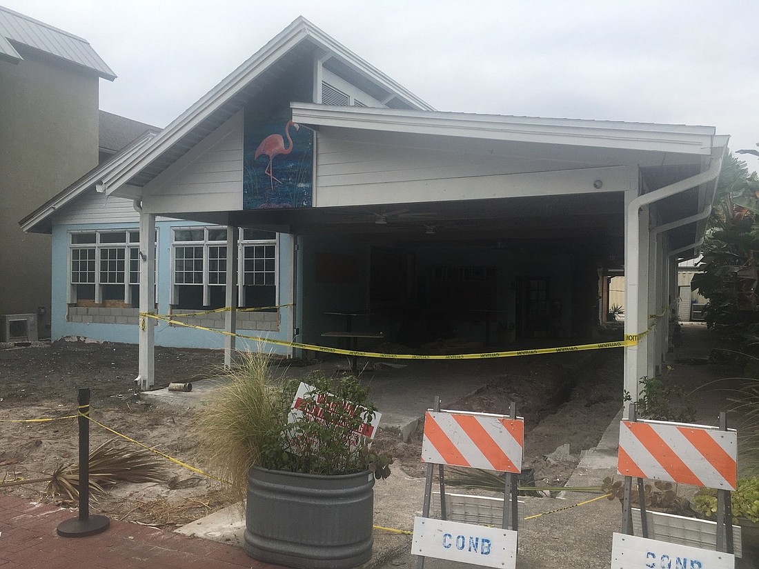 The exterior of Sliders Oyster Bar is getting a makeover that will include adding garage doors and new outdoor seating.