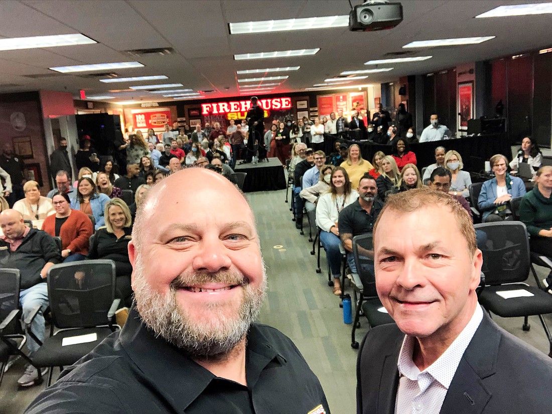 Brothers Robin, left, and Chris Sorensen, co-founders of Firehouse Subs, at the employee meeting Nov. 15 when the companyâ€™s pending $1 billion sale to Canada-based Restaurant Brands International Inc. was announced.