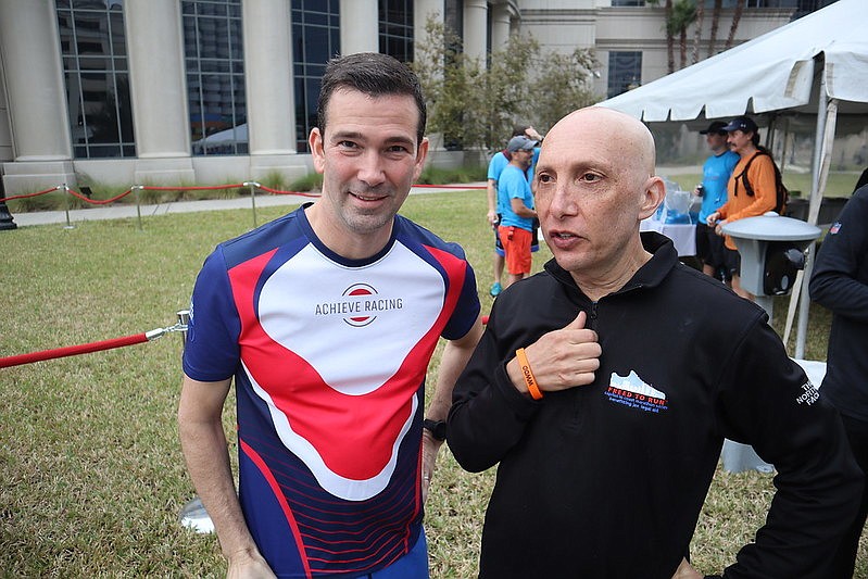 VyStar Credit Union CEO Brian Wolfburg, left, and attorney Mike Freed at the finish line of Freed to Run at the Duval County Courthouse on Nov. 20.