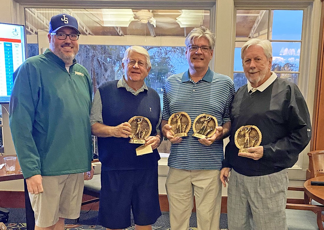 From left, Jacksonville Bar Association Executive Director Craig Shoup presented second-place trophies from the 2021 Members Golf Tournament to Pat Coleman, Jim Nolan and S. Grier Wells. Not shown: Troy Smith.