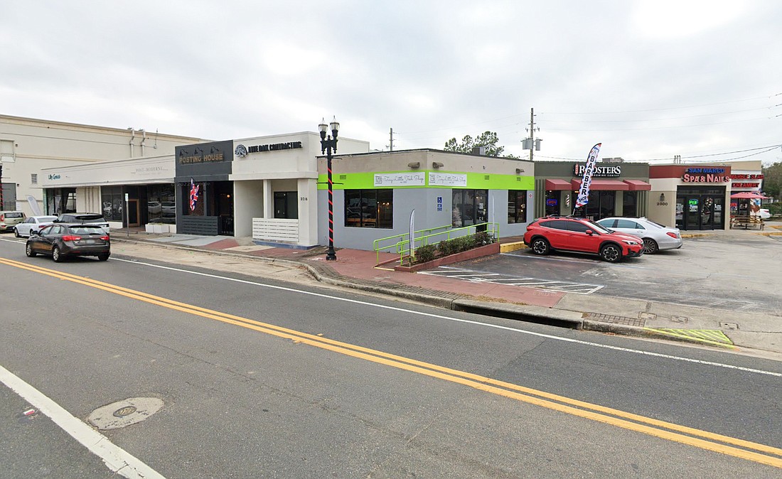 Roosters Menâ€™s Grooming Center and the Posting House neighborhood bar are tenants of the shopping center. (Google)