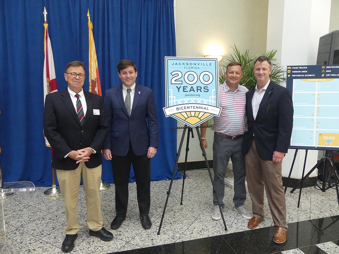 From left, Jacksonville Historical Society CEO Alan Bliss; society board Chair Dave Chauncey; Alan Verlander, CEO of Airstream Ventures LLC; and Dave Auchter, JHS board member and chair of the societyâ€™s Bicentennial Task Force.