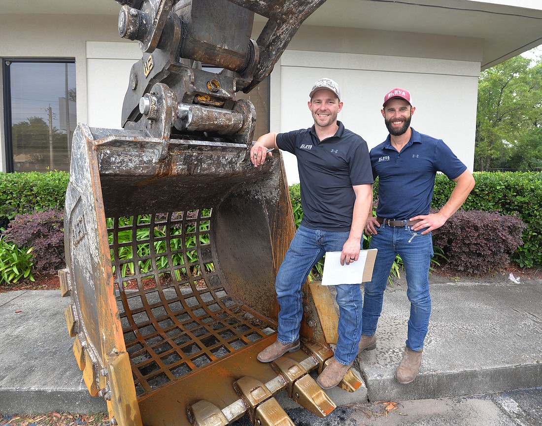 Brothers Ben and Jon Pfotenhauer, owners of ELEV8 Demolition, are among the regionâ€™s biggest contracting firms based on 2021 revenue. (Photo by Dede Smith)