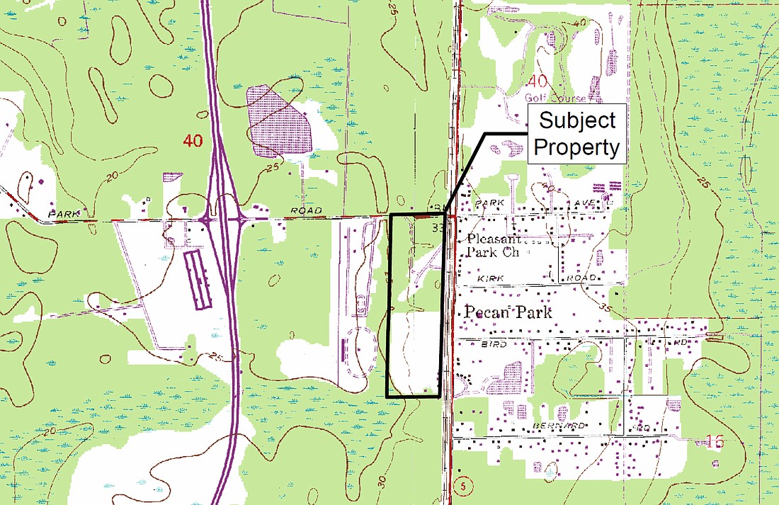 The property is at 186 Pecan Park Road, at southwest Pecan Park Road and North Main Street.