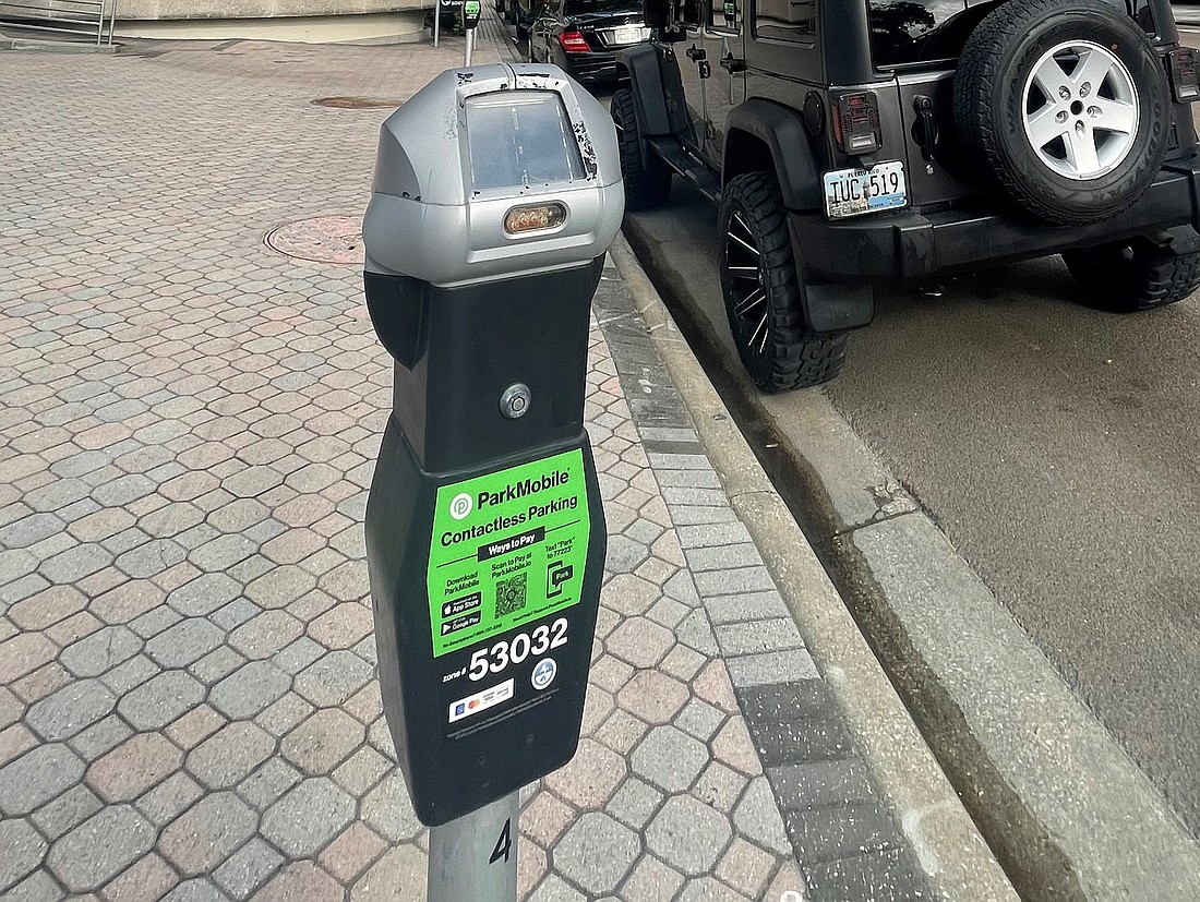 A parking meter in Downtown Jacksonville with the ParkMobile sticker.