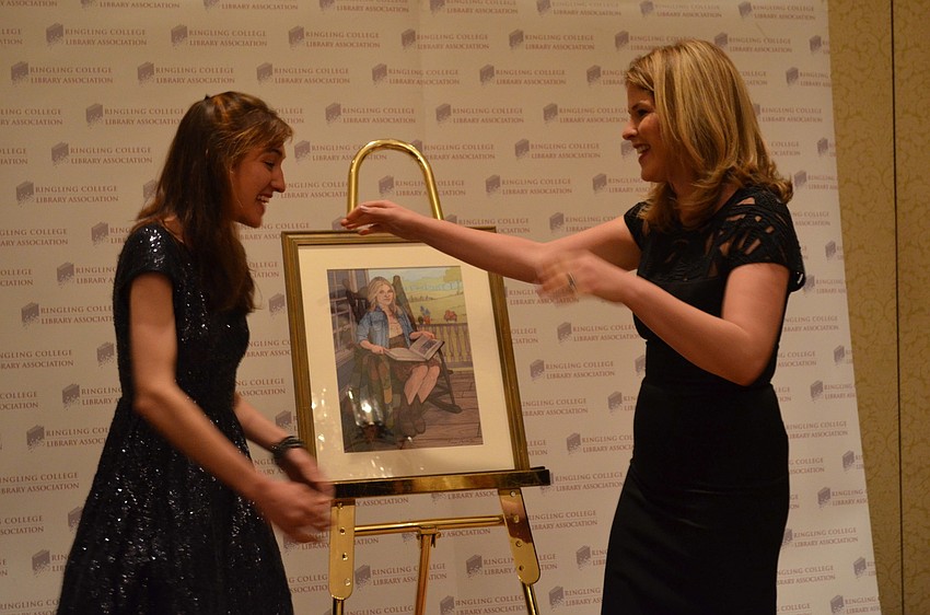 Ringling student Brenna Thummler and Jenna Bush Hager embrace in a hug after the student shows the speaker her portrait.