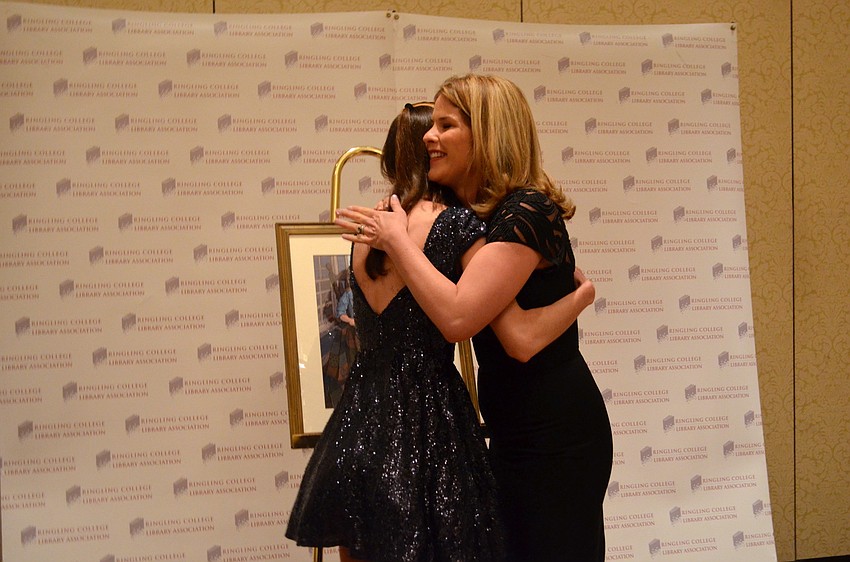 Ringling student Brenna Thummler and Jenna Bush Hager embrace in a hug after the student shows the speaker her portrait.