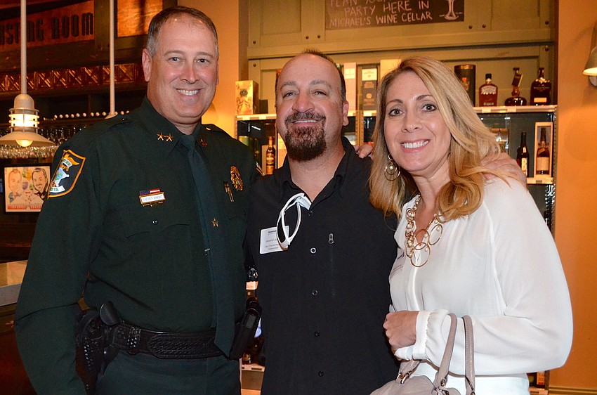 Sheriff Tom Knight, Maverick Johnson and Sandy Young
