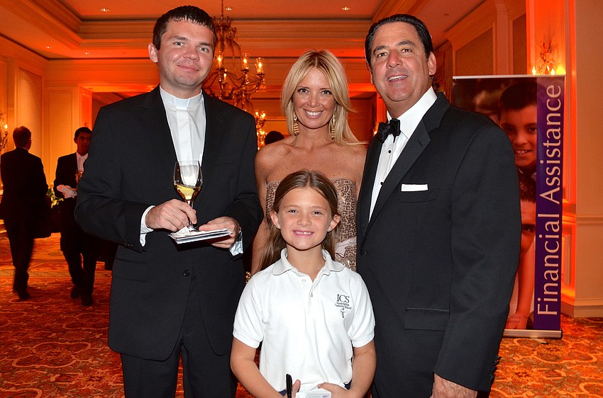 Fr. Sebastian Szczawinski with Bernice, Helena and Patrick Hebda