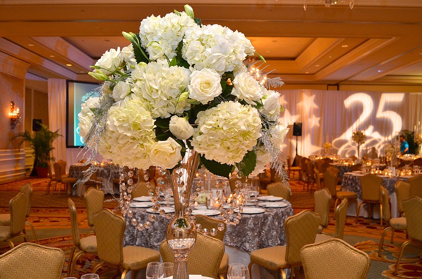 The table dÃ©cor at the 30th Anniversary Catholic Charities Ball