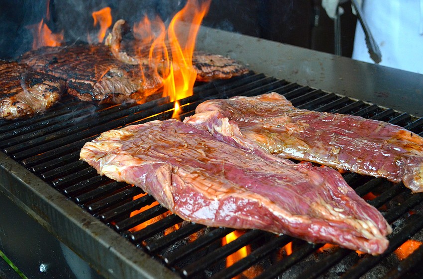 Michaelâ€™s On East preparing food at Forks & Corks