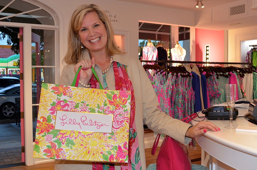 Amanda Morris is excited about her purchases at the Lilly Pulitzer Sarasota Spring 2014 Launch Party.