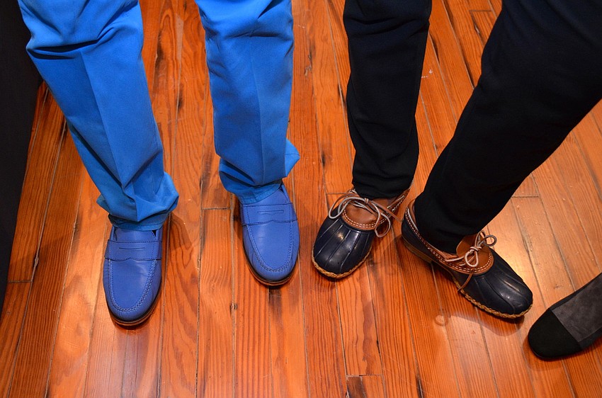 Dan Babcock and Miqui Lora show off their blue shoes at the Blue Ties and Butterflies Preview Party.