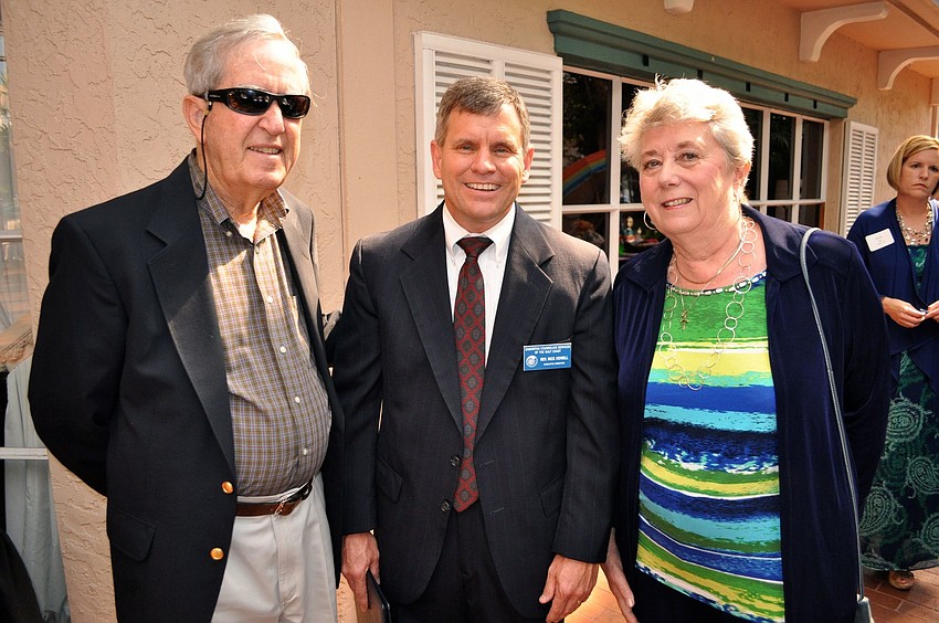 Martin Johnson, Rev. Rick Howell and Kathryn Johnson