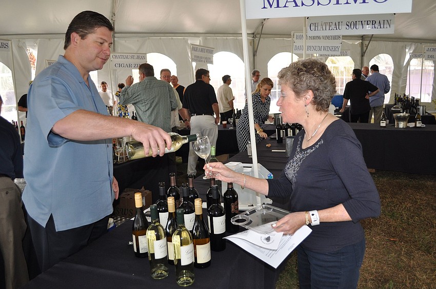 Eric Wehrle pours some wine for Linda Wilson.