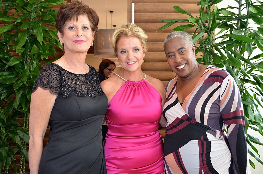 Manatee County Commissioner Robin DiSabatino, Sarasota Police Chief Bernadette DiPino and Sarasota County Commissioner Carolyn Mason model in the Selah Freedom fashion show.