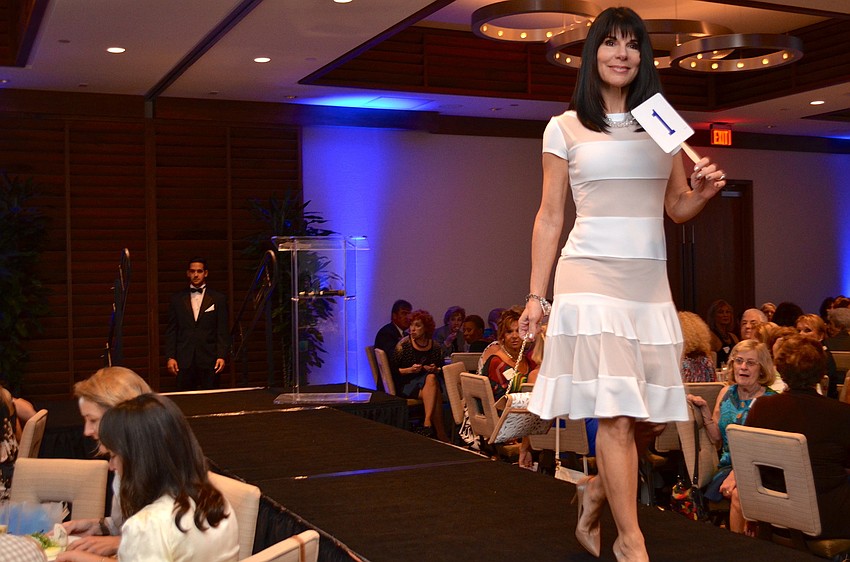 Mary Forristallmodels an A-line dress from Foxy Lady in the fashion show.