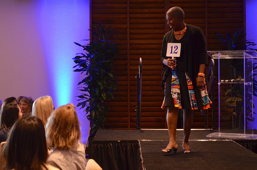 Sarasota County Commissioner Carolyn Mason models dress and shrug from Foxy Lady in the fashion show.