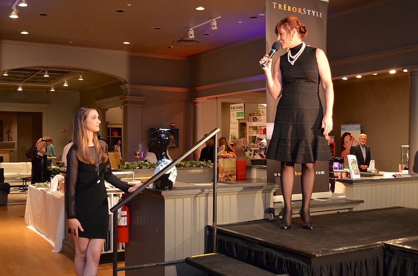 Singer Jordan Boyer is welcomed on stage by Marilee Roberts
