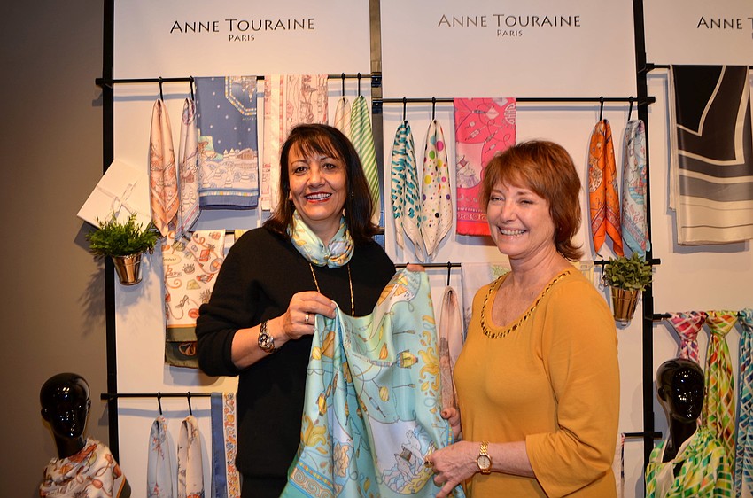 Anne Touraine shows Marilyn Margold the many ways to wear a scarf.