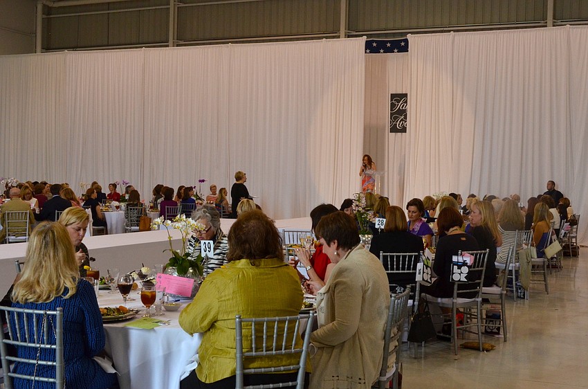 Honorary Chairwoman Eileen Curd welcomes guests to the 15th annual Sarasota Womenâ€™s Cancer Awareness Luncheon â€˜Cure on the Runway.â€™